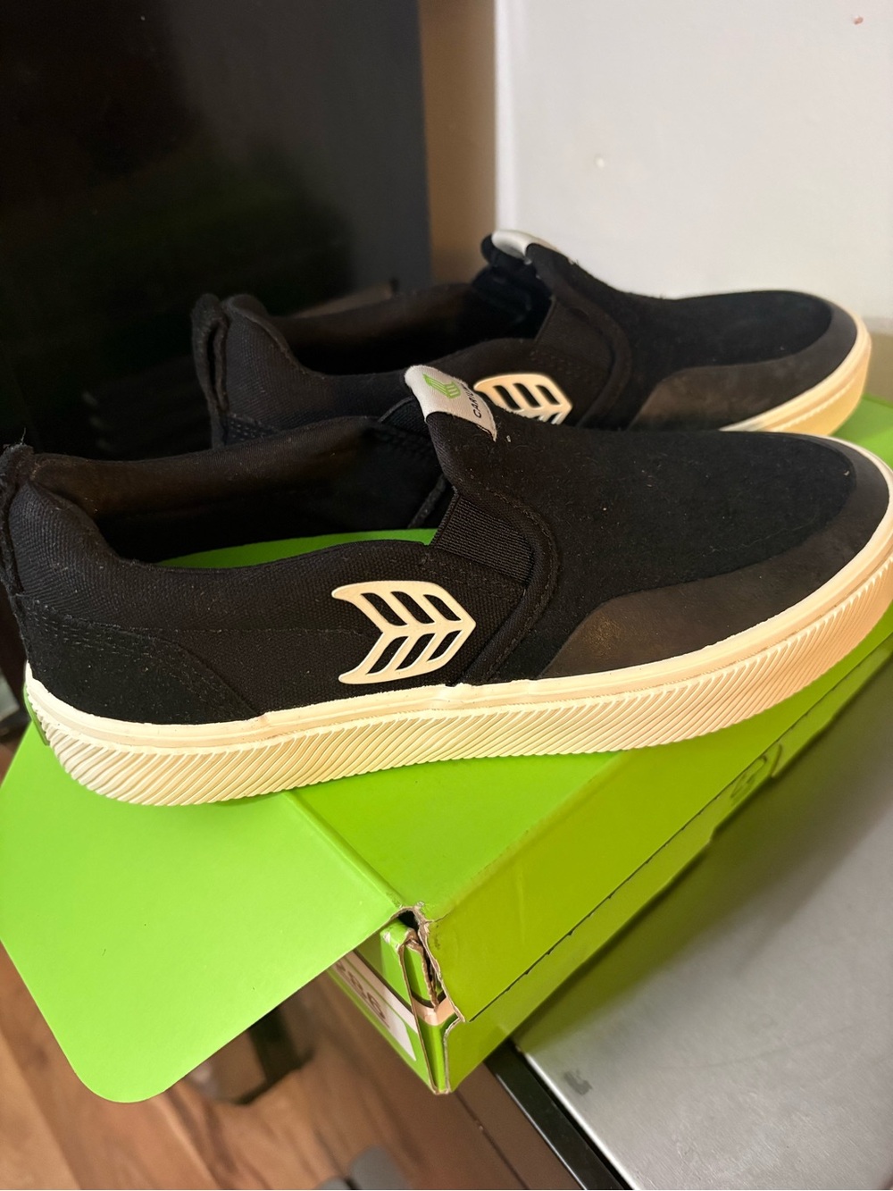 Cariuma Black Slip-On Sneakers with White Accents